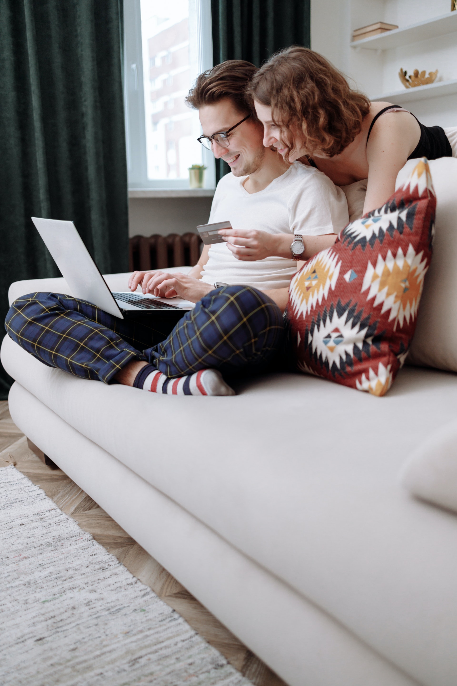 Couple conducting online purchase